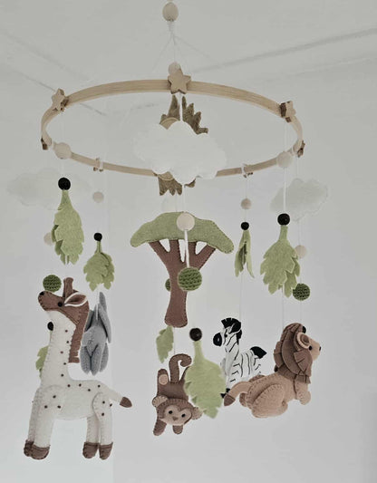Baby mobile with safari animal figures on a white background