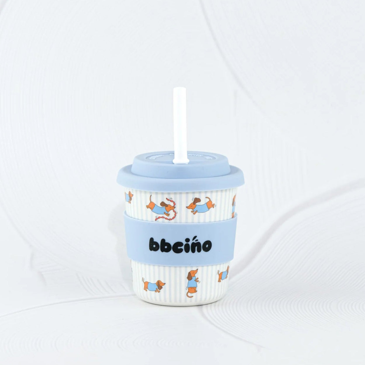 Children's cup with a straw and blue lid on a white background