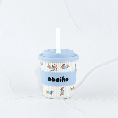 Children's cup with a straw and blue lid on a white background