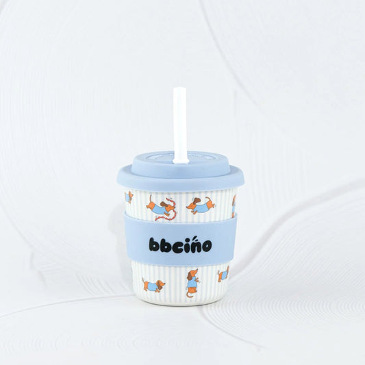 Children's cup with a straw and blue lid on a white background