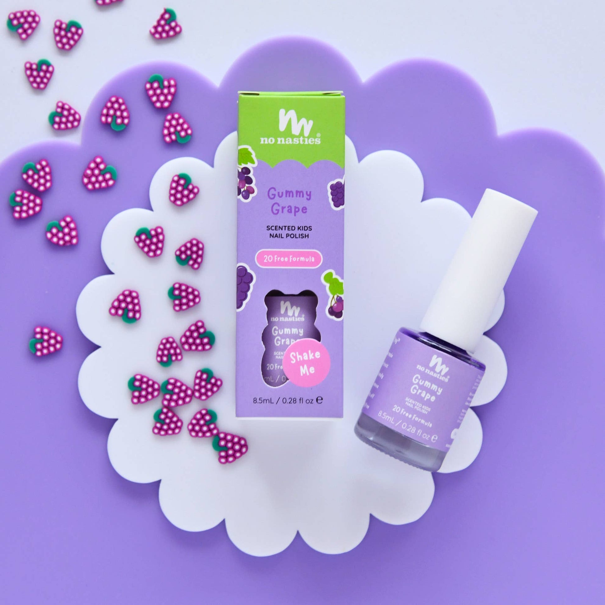 Gummy Grape scented kids nail polish with packaging on a purple background