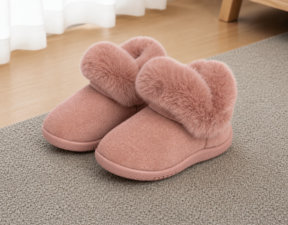 Pair of pink slippers with fluffy fur trim on a carpeted floor.