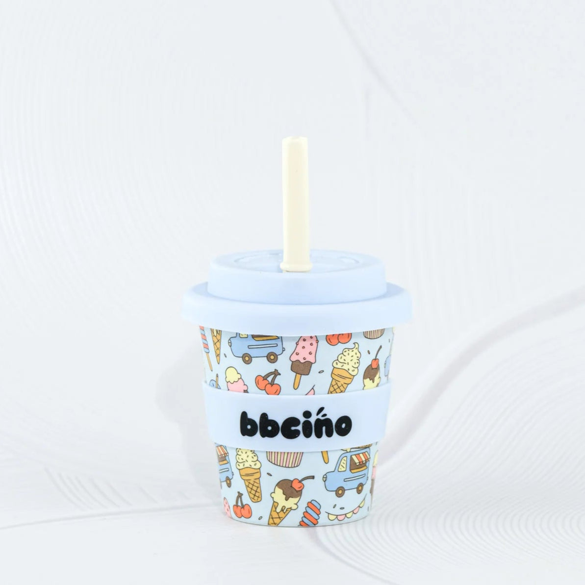 Ice cream-themed cup with a straw on a white background