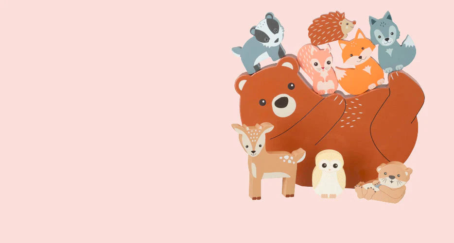 Cartoon bear with various small animals on a pink background